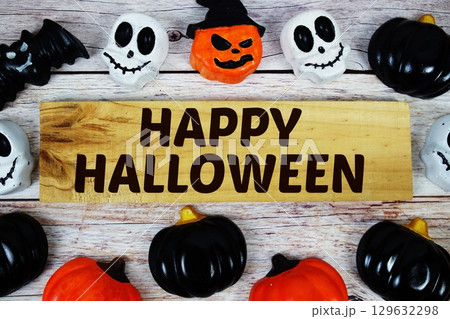 Happy Halloween text with element decorations on orange background 129632298