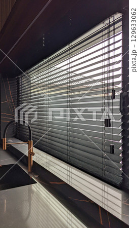 Black Wooden Horizontal Blinds in Modern Kitchen 129633062