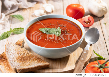 Homemade Tomato Soup in bowl with Basil 129634077