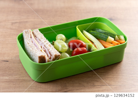 Healthy Lunchbox for school with sandwich,fruit and vegetables 129634152