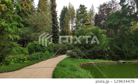 Pathway winding through lush green park in pruhonice, czech republic Pathway winding through lush green park in pruhonice, czech republic 129634470