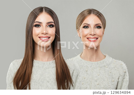Pretty young model woman and mature woman. Two female faces collage set. Old and young face 129634894