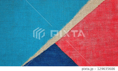 Colorful geometric patterns created with fabric, showcasing vibrant hues of blue, red, and beige Colorful geometric patterns created with fabric, showcasing vibrant hues of blue, red, and beige 129635686