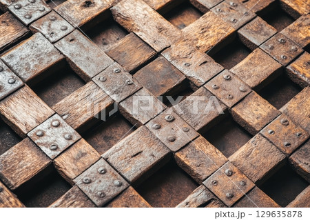 Wooden lattice structure showcases craftsmanship with intricate details and natural finish 129635878