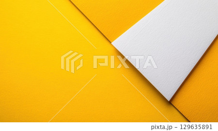 Bright yellow and white paper creates vibrant contrast for creative design projects Bright yellow and white paper creates vibrant contrast for creative design projects 129635891