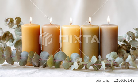 Stilllife with botanical decor and beeswax candles on matte white surface, minimal and calming composition for interior lifestyle content. Stilllife with botanical decor and beeswax candles on matte white surface, minimal and calming composition for interior lifestyle content. 129636148