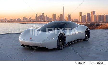 Sleek Silver Electric Car at Sunset Over City Skyline Sleek Silver Electric Car at Sunset Over City Skyline 129636612