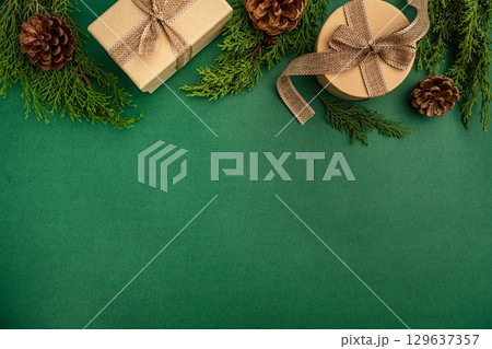 Rustic Christmas Flat Lay with Gifts and Pine Cones 129637357