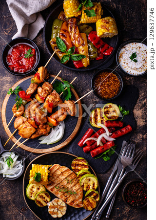 Assortment of grilled bbq meat and vegetables 129637746