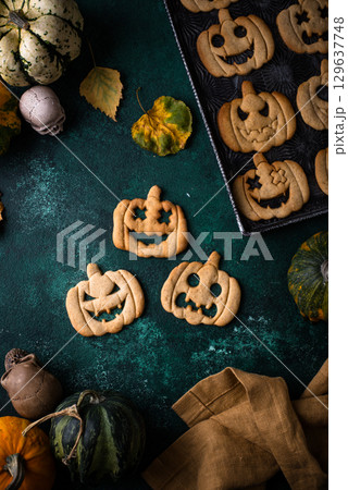 Halloween cookies in shape of jack-o-lantern 129637748