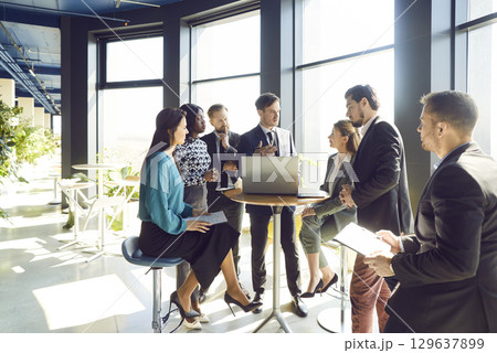 Young people group of company employees talking on business meeting during a conference. 129637899