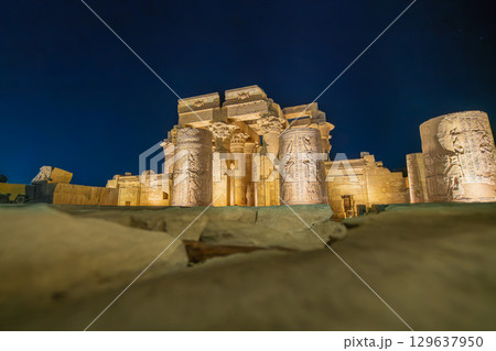 Illuminated Wall of the Temple of Kom Ombo in Egypt at Night. 129637950