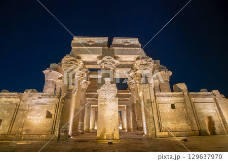 Temple of Kom Ombo front facade with decorated columns at night Egypt. 129637970