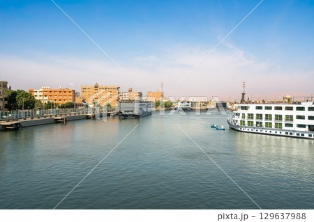 Nile River cruise ships entering Esna Lock waterway system Egypt. Nile River cruise ships entering Esna Lock waterway system Egypt. 129637988