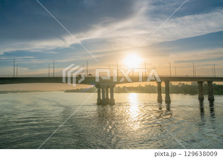 Sunset Over the Nile River Bridge in Luxor with Cityscape. Sunset Over the Nile River Bridge in Luxor with Cityscape. 129638009