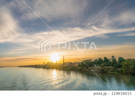 Sunset over Nile River near Esna Lock in Egypt. Sunset over Nile River near Esna Lock in Egypt. 129638015
