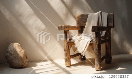 Serene composition of wooden chair in soft warm light for interior stock or lifestyle branding 129638327