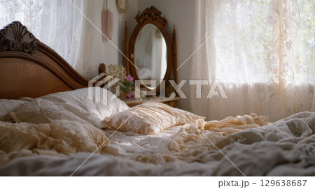 Cozy slow living interior with antique bedframe and lace curtains 129638687