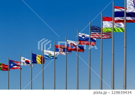 flags of countries against blue sky flags of countries against blue sky 129639434