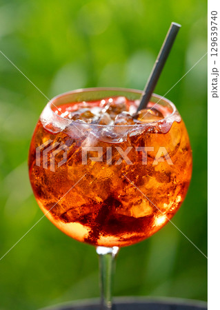glass of aperol spritz cocktail 129639740