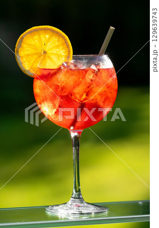 glass of aperol spritz cocktail 129639743