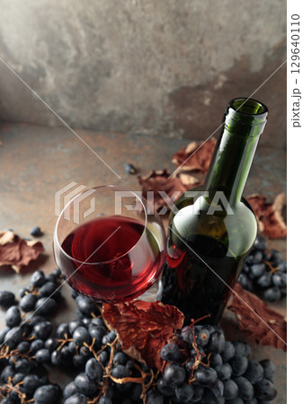 Red wine and blue grapes. Red wine and blue grapes. 129640110