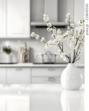 white kitchen room background for zoom calls. Minimal light room with wooden table in foreground white kitchen room background for zoom calls. Minimal light room with wooden table in foreground 129640500