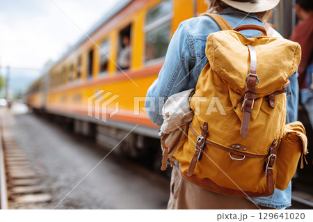 Scenic rural station stop with travelers waiting for train arrival Scenic rural station stop with travelers waiting for train arrival 129641020
