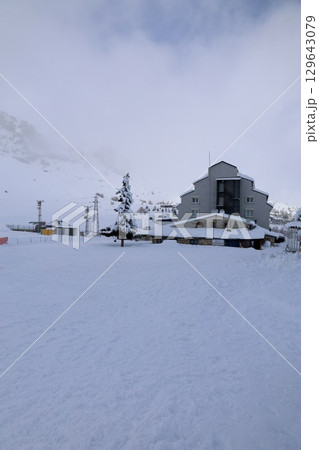 A building with snow on the ground. High quality photo A building with snow on the ground. High quality photo 129643079