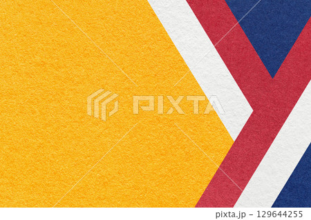 Abstract yellow textured paper background with white, red, blue geometric lines, copy space for graphic banner 129644255