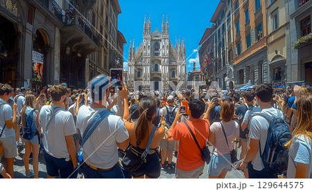 Milan Cathedral captured by tourists on a sunny day in Italy, sh 129644575