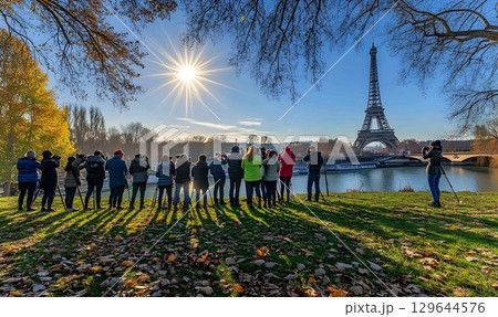 Eiffel Tower Photographers Gather on Autumnal Bank of Seine Rive 129644576