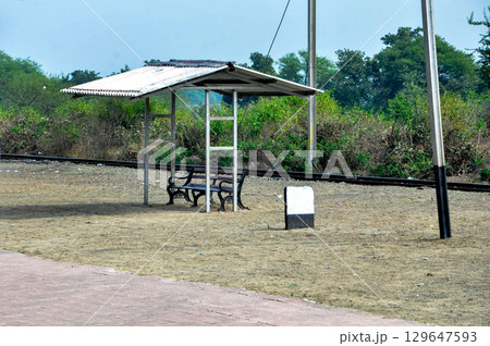 Small Rural Railway Platform with Bench and Shed in Countryside 129647593