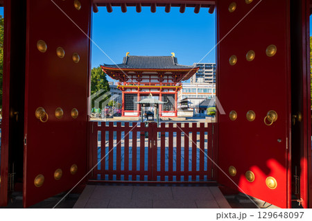 Shitennoji Temple Sanmon gate view from red gate at autumn, Osaka Shitennoji Temple Sanmon gate view from red gate at autumn, Osaka 129648097