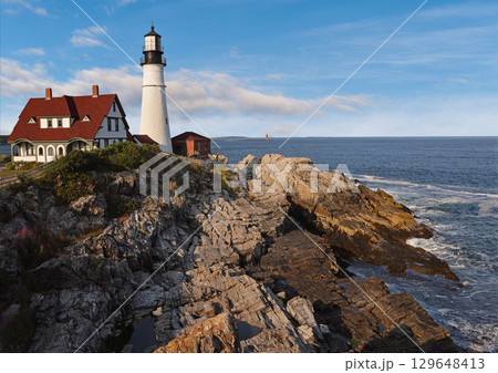Portland Head Light in late afternoon surrounded by with dramatic waves and cliffs, Maine, USA Portland Head Light in late afternoon surrounded by with dramatic waves and cliffs, Maine, USA 129648413