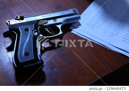 Revolver on a Table in police station Revolver on a Table in police station 129648473