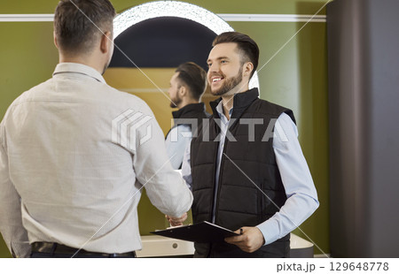 Consultant And Client Handshaking In Plumbing Store 129648778
