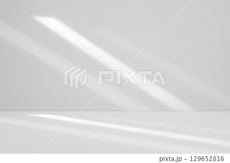 Abstract white studio room with light and shadow from window background for product display presentation Abstract white studio room with light and shadow from window background for product display presentation 129652816