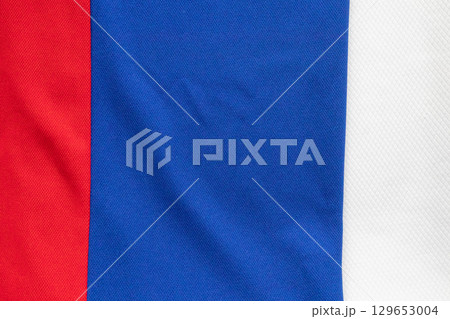 White blue and red sports clothing fabric football shirt jersey texture background White blue and red sports clothing fabric football shirt jersey texture background 129653004