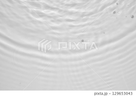 Abstract white transparent water shadow surface texture natural ripple background 129653043