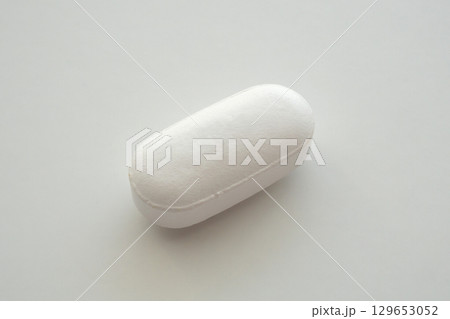 White medicine pill tablet on white background 129653052
