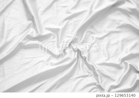 Abstract white wrinkled bedding sheet fabric texture background Abstract white wrinkled bedding sheet fabric texture background 129653140