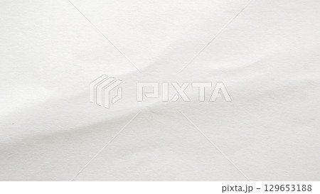 Abstract white crumpled and creased recycle paper texture background 129653188