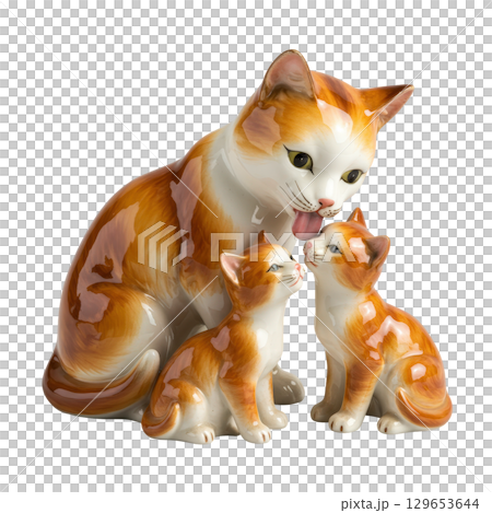 Porcelain figurine of a ginger cat mother licking her two kittens family love and care concept 129653644