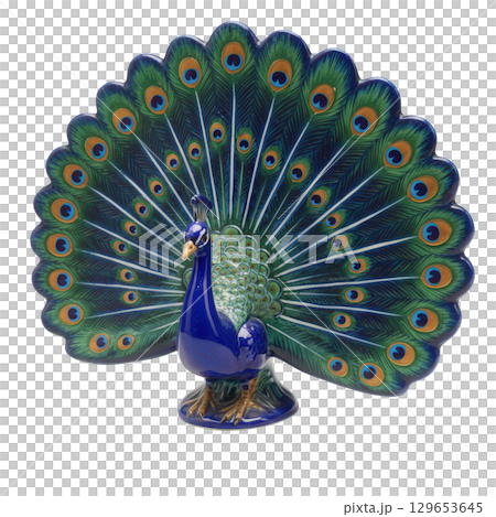 Colorful ceramic peacock statuette with its beautiful tail fully fanned out in bright blue 129653645