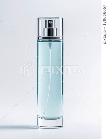 Elegant cosmetic spray bottle mockup. A blank, unbranded clear glass container with blue liquid and a silver pump, isolated on a white background for branding and design templates. Elegant cosmetic spray bottle mockup. A blank, unbranded clear glass container with blue liquid and a silver pump, isolated on a white background for branding and design templates. 129656067