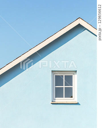 Blue house roof top with window sky background. AI Generated. 129656612