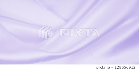 Smooth elegant lilac silk or satin texture as wedding background. Luxurious valentine day background design 129656912