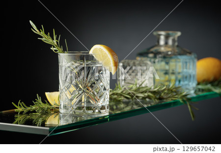 Gin tonic cocktail in a crystal glass. 129657042