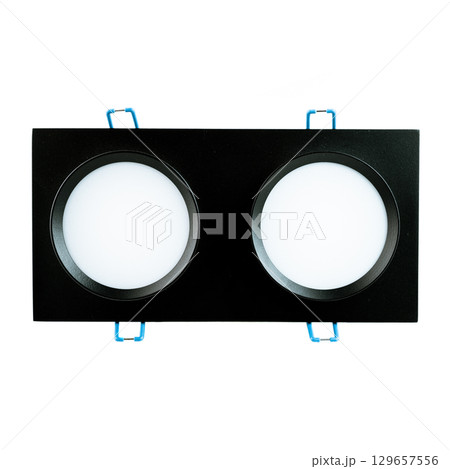 Black double round recessed ceiling spotlight, isolated on white background, modern lighting fixture for home, office, or commercial interiors. 129657556